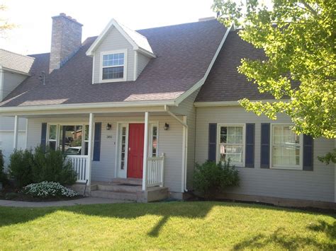 light grey house with shutters.